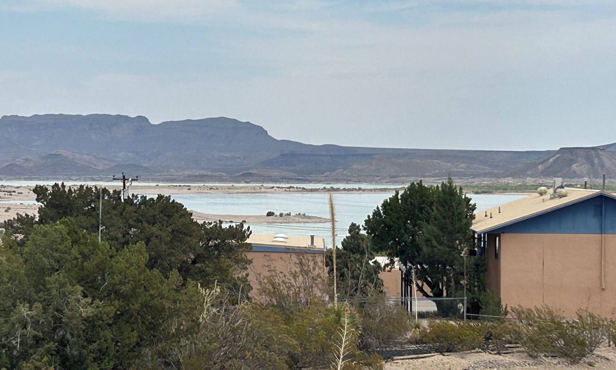 Elephant Butte House | Happy Place II @ the Butte with a lake view from the patio and family room.