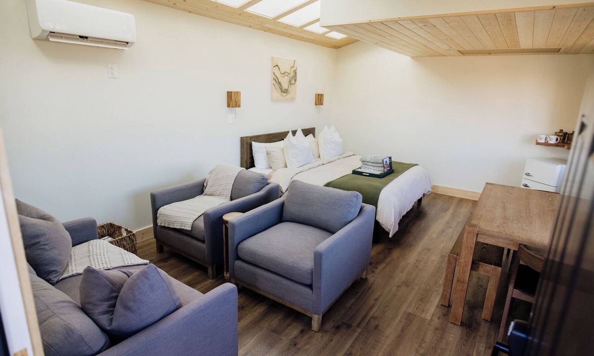Monticello RV Rental | Solar Powered Casita with 2 beds and a comfy seating area overlooking a peaceful desert setting