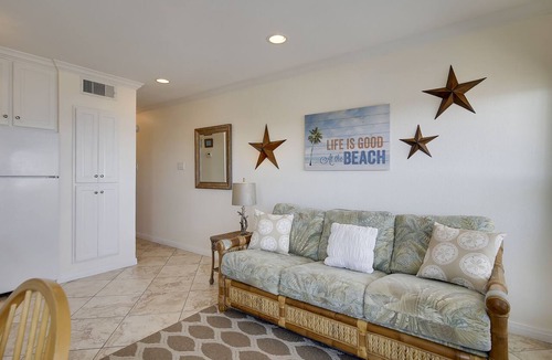Galveston Condo | Beach Cottage steps from Surf. fishing. the Beach and Serene Sunsets (1303)