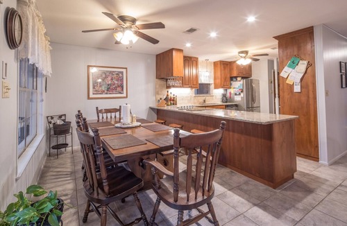 New Braunfels House | Bohemian Hill: NB Cypress-Lined Guadalupe Riverfront + Main & Guest House + Shady Decks & Backyard