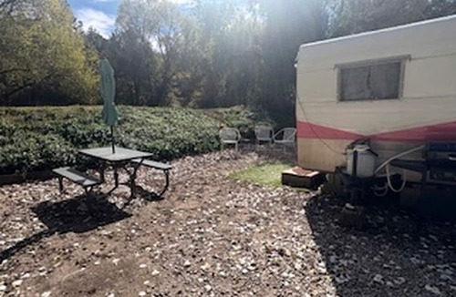 Mayhill House | Charming Vintage Shasta Camper with Riverside Glamping Charm Near Pavilion Food Truck Scene in Mayhill, New Mexico