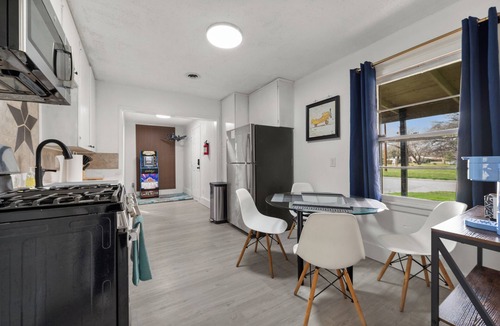 Westworth Village House | Cleared for Landing: The Pilot's Lounge. 4BR TV Every Bedroom Exterior Patio