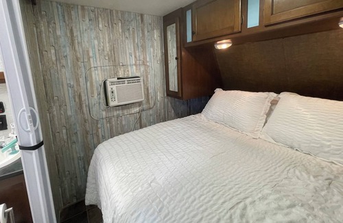 Aztec House | Cozy RV on working farm. 1 bedroom with queen size bed, 2 twin size beds.