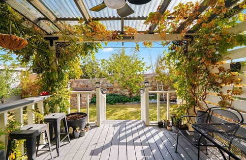 El Paso House | Discover your home away from home in this family-friendly 2BR/2.5BA El Paso house featuring a private fenced garden, covered patio, dedicated gym with BioFlex machine, and office with printer. Please note, this home has evaporative cooling (swamp
