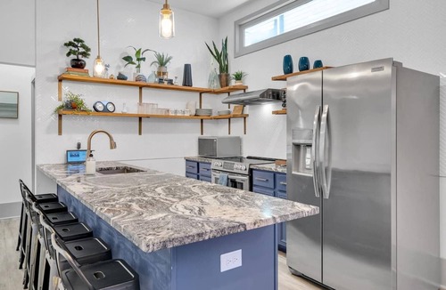 Tulane - Gravier House | Eco-friendly 5BR Mid-City home near Superdome. Fire pit, parking, walk to streetcar & parades.