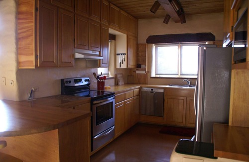 Tyrone House | Escape a cold winter in our large passive solar adobe home with 4 gentle seasons