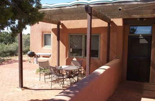 Tyrone House | Escape a cold winter in our large passive solar adobe home with 4 gentle seasons