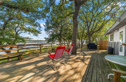 Bowie Cabin | Escape to a Cozy Lakefront Cabin on Lake Amon Carter with Private Dock
