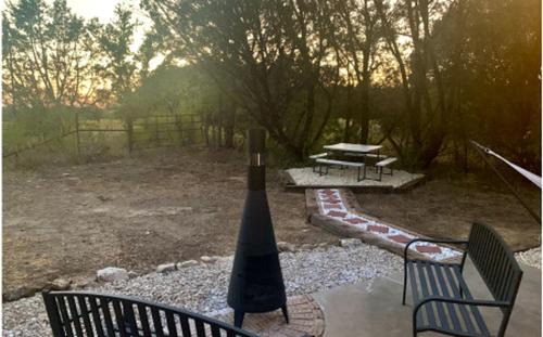 Paluxy House | Family Cabin Getaway with an Outdoor Fireplace near Lake Granbury in Texas