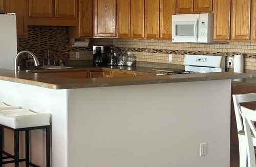 Elephant Butte House | Happy Place II @ the Butte with a lake view from the patio and family room.