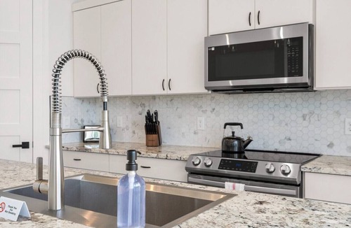 Comanche Trail House | Hilltop Home + Guest Casita w Sweeping Lake Travis Views from Your Rooftop Deck