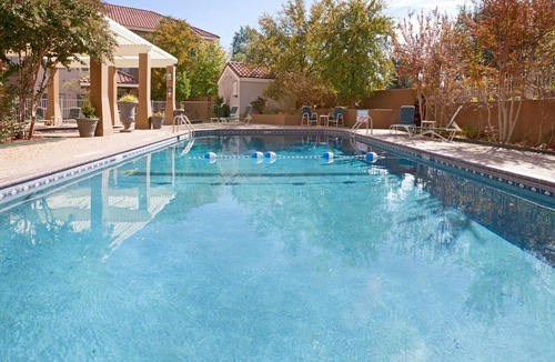 Tech Terrace Condo | King Suite. Shared Pool & Hot Tub. Free Breakfast. Near Texas Tech University & University Medical Center.