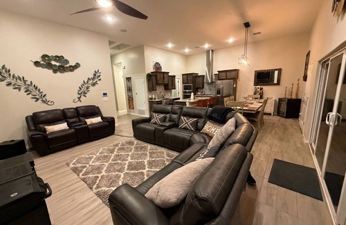 Biggs Field House | Luxurious El Paso Oasis: Modern 5BR, Huge Patio with Kitchen, TV, & Lounge Area