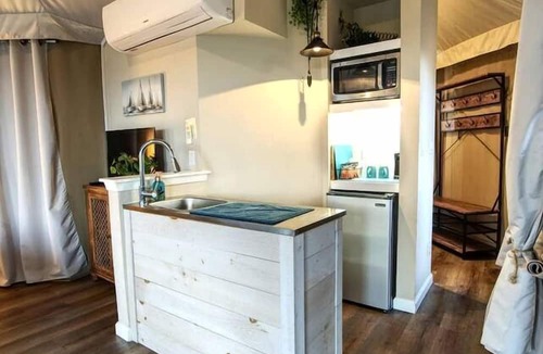 Oatmeal RV Rental | Luxury Hilltop Safari Tent with Private Hot Tub near Lake Travis in Marble Falls, Texas