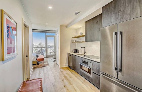 Rainey Street Historic District Apartment | Natiivo Austin studio - lake & skyline-view balcony, pool & gym - dogs OK