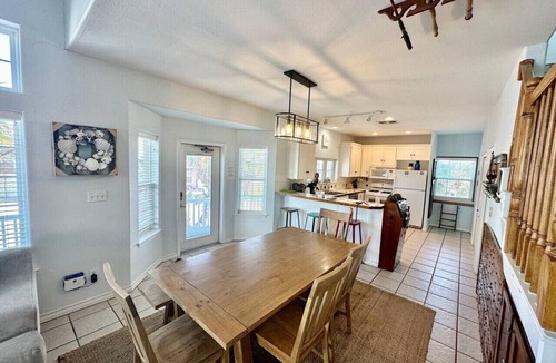 Sand Point House | "Prime coastal retreat just steps from the beach! Unwind by the community pool or ride the waves for the ultimate seaside escape."