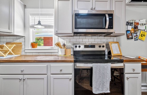 Bisbee House | Refined Miner’s Cottage: Fenced Yard, Screened Porch.