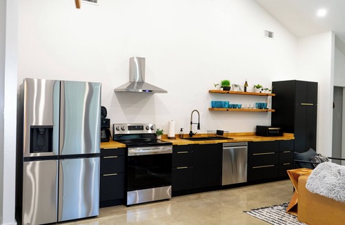 Forestburg House | Relax at this Modern Rustic Barndominium in Nocona. This 2BR, 2BA retreat offers an open layout, chef’s kitchen, spa-style baths, and outdoor patio with fire pit, perfect for families, couples, or friends under the Texas stars.