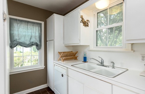 Bay Area House | Romantic 1938 Bay House Steps from Ocean Dr Porches, Gardens & Coastal Charm