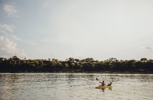 Naumanns Camp Bed & Breakfast | Romantic Lakefront Escape: Massage, Yoga, Winery, Kayaks, SUPs, Krause Springs!
