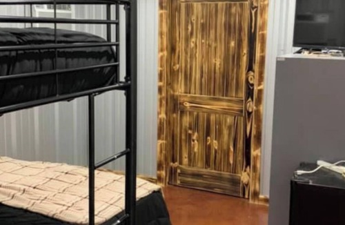 Burkett Cabin | Rustic Texas Ranch Lodge Sleeps 45~Private Lake~Exotic Wildlife~Group Getaways