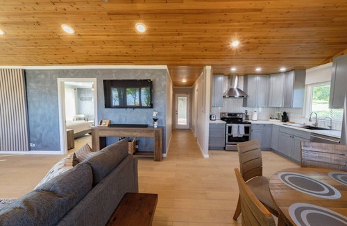 Lakewood Estates Cottage | Serene Lakefront Cottage on Lake Travis with Boathouse and swings.