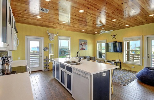 Port Aransas House | Situated on the stock pond at Ocean Village, adjacent to the neighborhood pool a