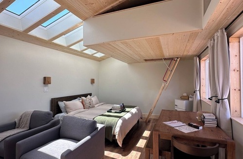 Monticello RV Rental | Solar Powered Casita with 2 beds and a comfy seating area overlooking a peaceful desert setting