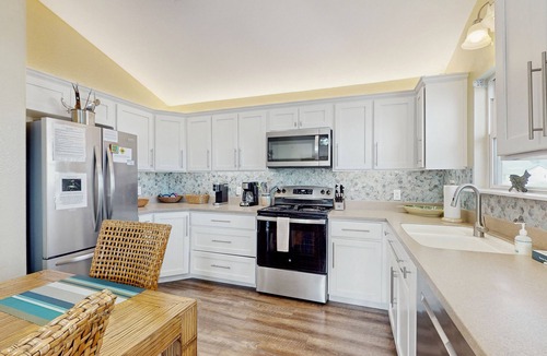 City-by-the Sea House | Welcome to The Lazy Bay | Canal Front Home with Boat Dock