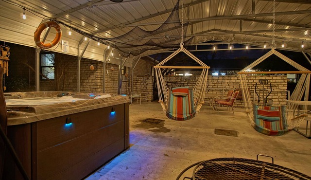 5 Bedrooms, 5.5 Baths, covered porches, hot tub, game room, walk to the square.