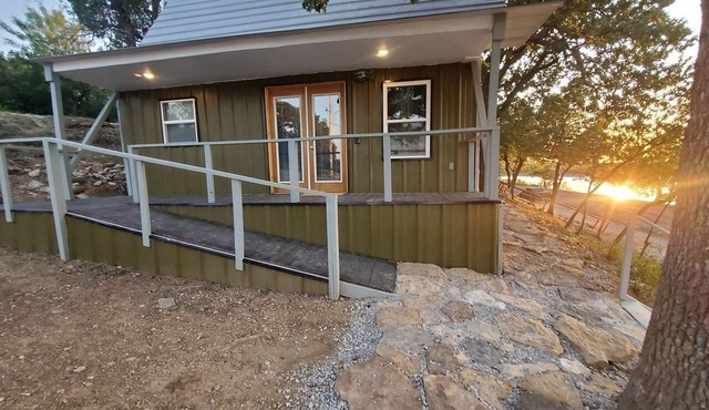 Charming Lakefront Cabin with Sandy Beach Access & Fire Pit Near Lake Cisco, TX