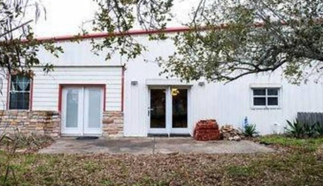 large home with lots of indoor and outdoor parking