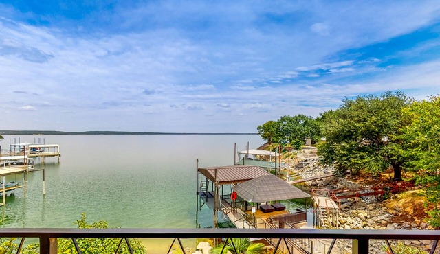 Luxury lake home with stunning water views, gourmet kitchen, hot tub & office