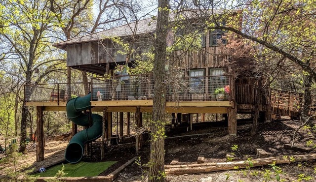 Magical Treehouse with Slide by Brazos River for Family Glamping Adventures in Texas