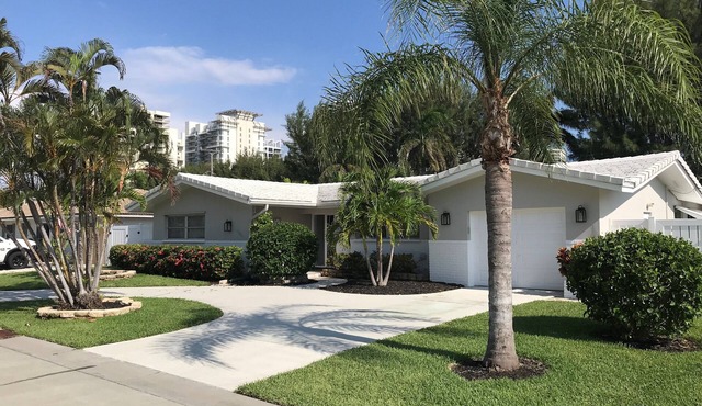 Single open-concept home one block from the ocean with heated pool and lanai in West Palm Beach