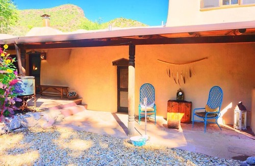 Pilar House | A romantic adobe, river retreat with outdoor tubs.