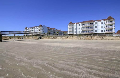 Galveston Condo | Trendy Beach Condo- Sunset views, Sandy Toes, Surfing more. (1304)