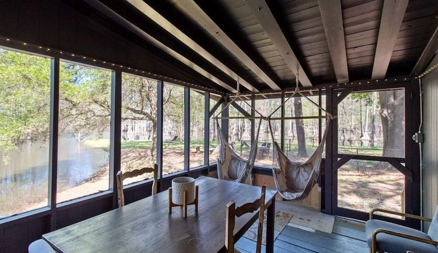 Wake up right at the water’s edge at Emerald Cove—sip coffee from hammock chairs on the screened porch, then paddle beneath a canopy of cypress trees. in Shreveport